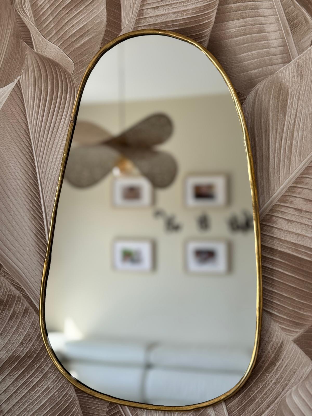 Miroir incurvé en laiton