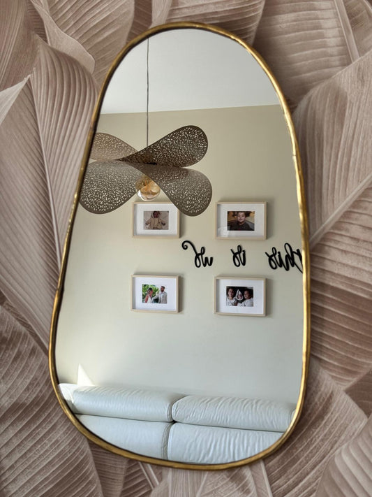 Miroir incurvé en laiton